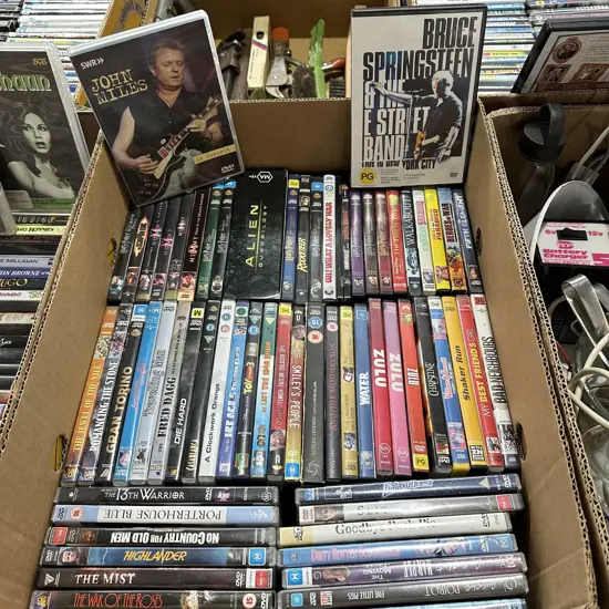 Box lot of DVD movies plus Bruce Springsteen live in NY.