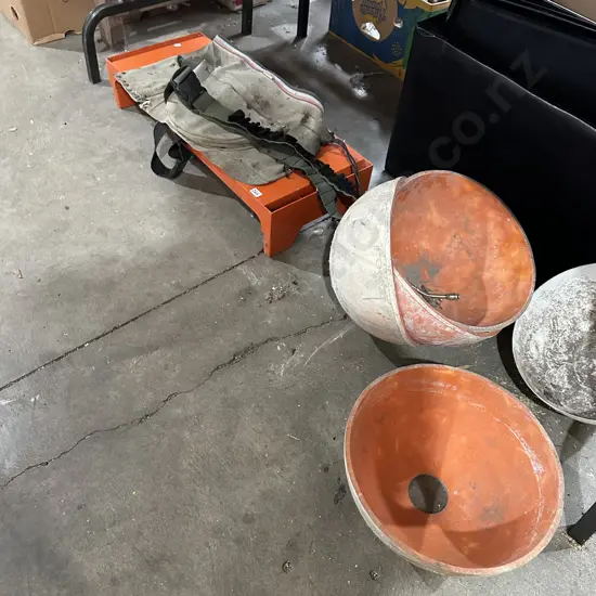 Bay lot carpenters apron, ammunition belt, concrete moulds and shelf.
