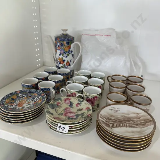 3 sets of demitasse coffee cups and a coffee pot