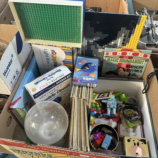 Box lot of vintage games, finding Dory cards, Lego board, golden books, light box etc.
