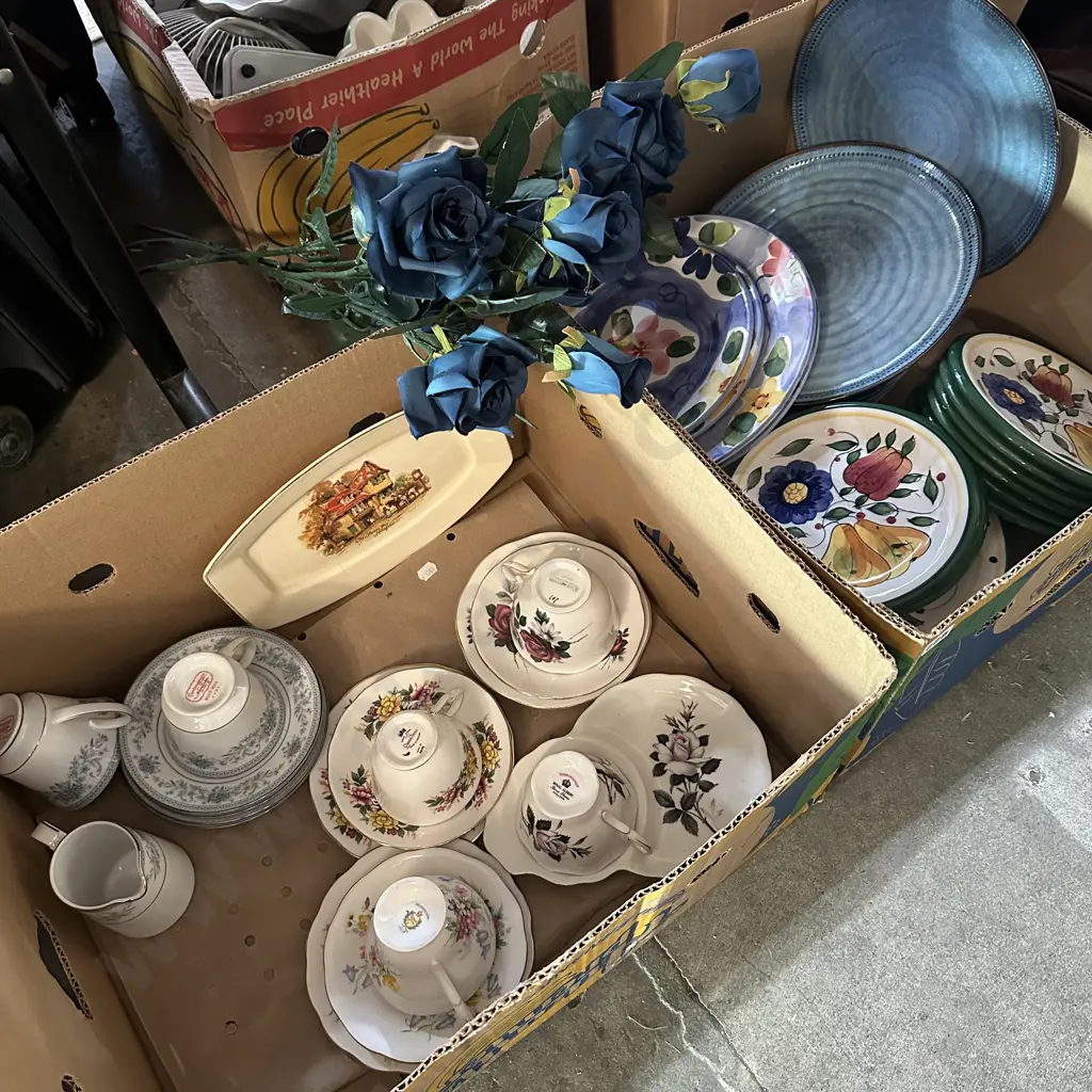 Two boxes of dinnerware plates and english chia plus blue artificial roses. Image 1++