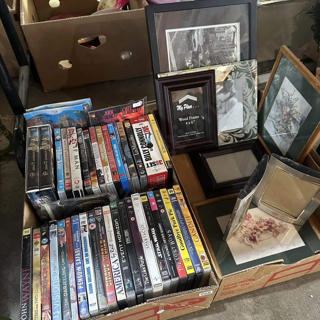 Two boxes DVDs and picture frames. Image 1++