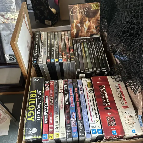 Box lot of DVDs including Bruce Lee set.
