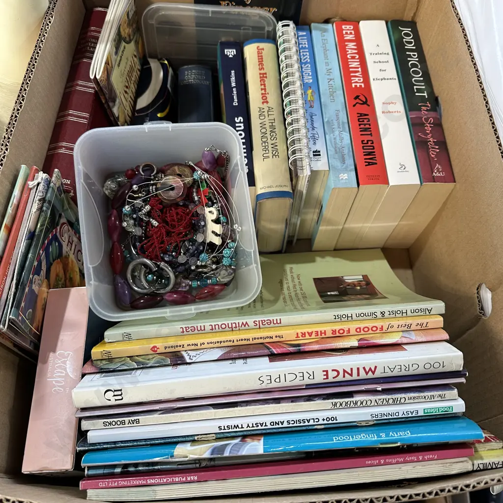 Box lot books and costume jewelry. Image 1++