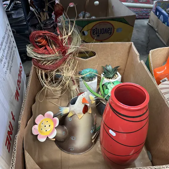 Vase, fake plants and decorative garden watering can.
