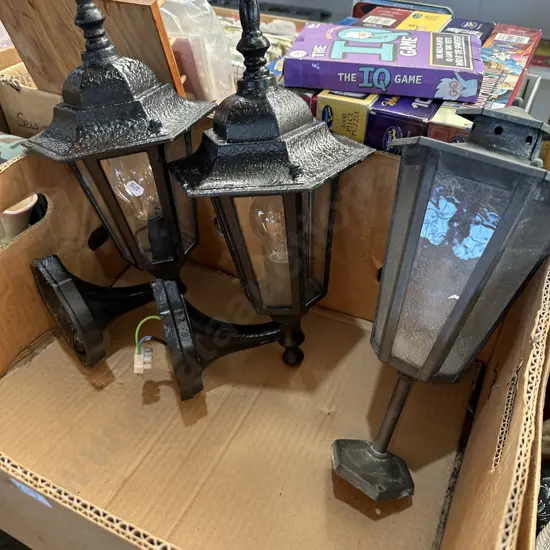 Pair of outdoor wall lights plus other pole-mount lantern.