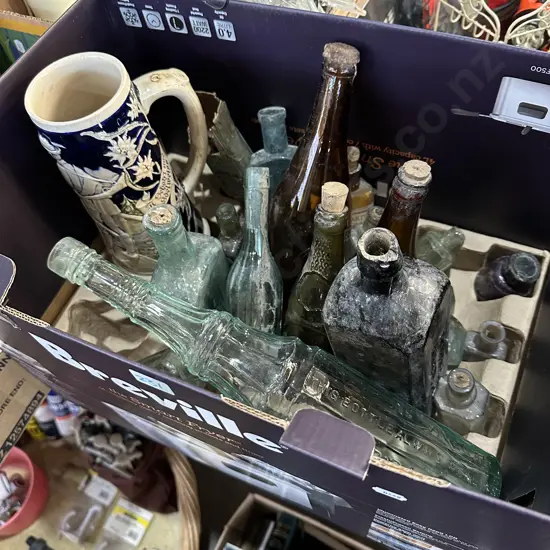 Box lot of old bottles and a vintage German beer stein (with damage)
