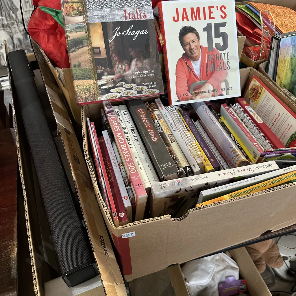 Box of books plus panasonic sound bar. Image 1++