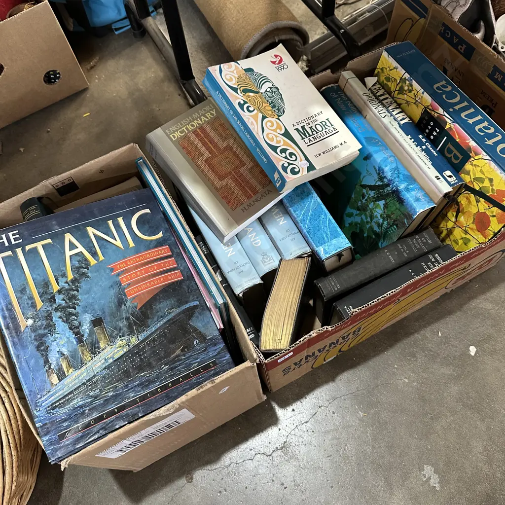 Two boxes of books including The Titanic and Maori dictionary etc. Image 1++