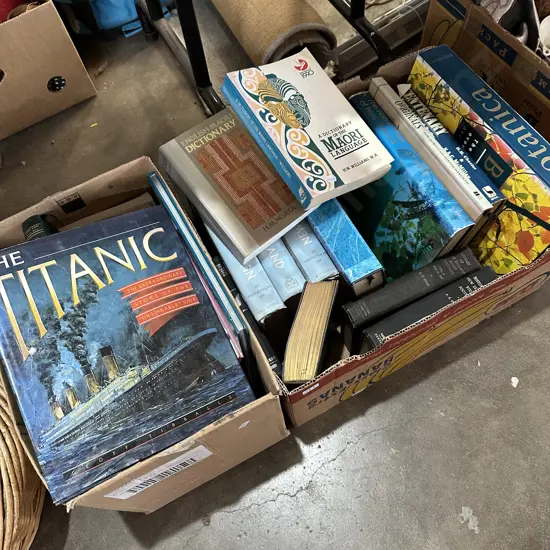Two boxes of books including The Titanic and Maori dictionary etc.