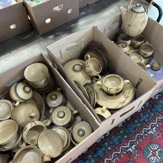 Three boxes of pottery.