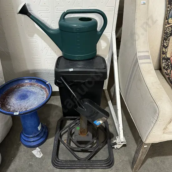 Bin, watering can, shovel and umbrella stand.