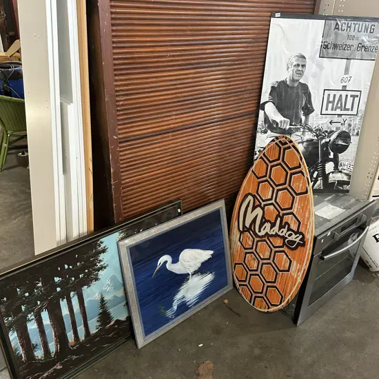 Three pictures and a skim board.