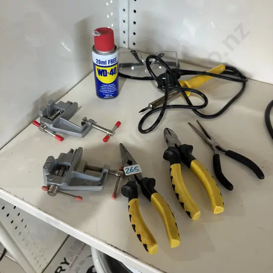 Shelf lot of assorted tools and WD-40.