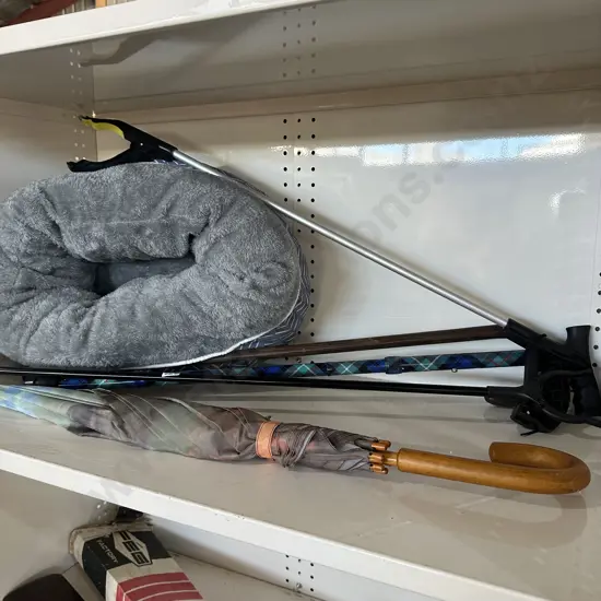 Two walking sticks, two claw grabbers, umbrella plus cat snuggler bed.