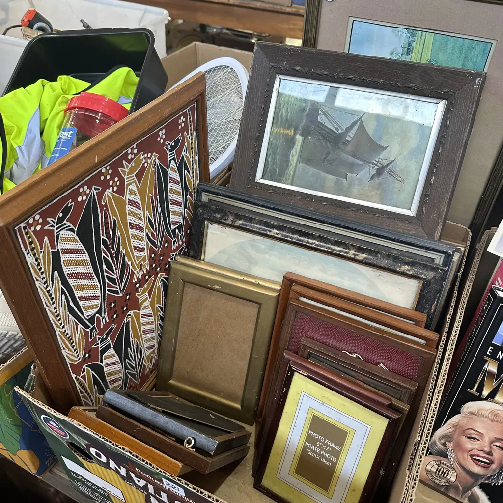 Box lot of assorted pictures and frames. Image 1++