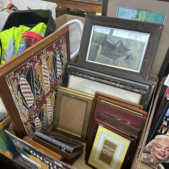 Box lot of assorted pictures and frames.