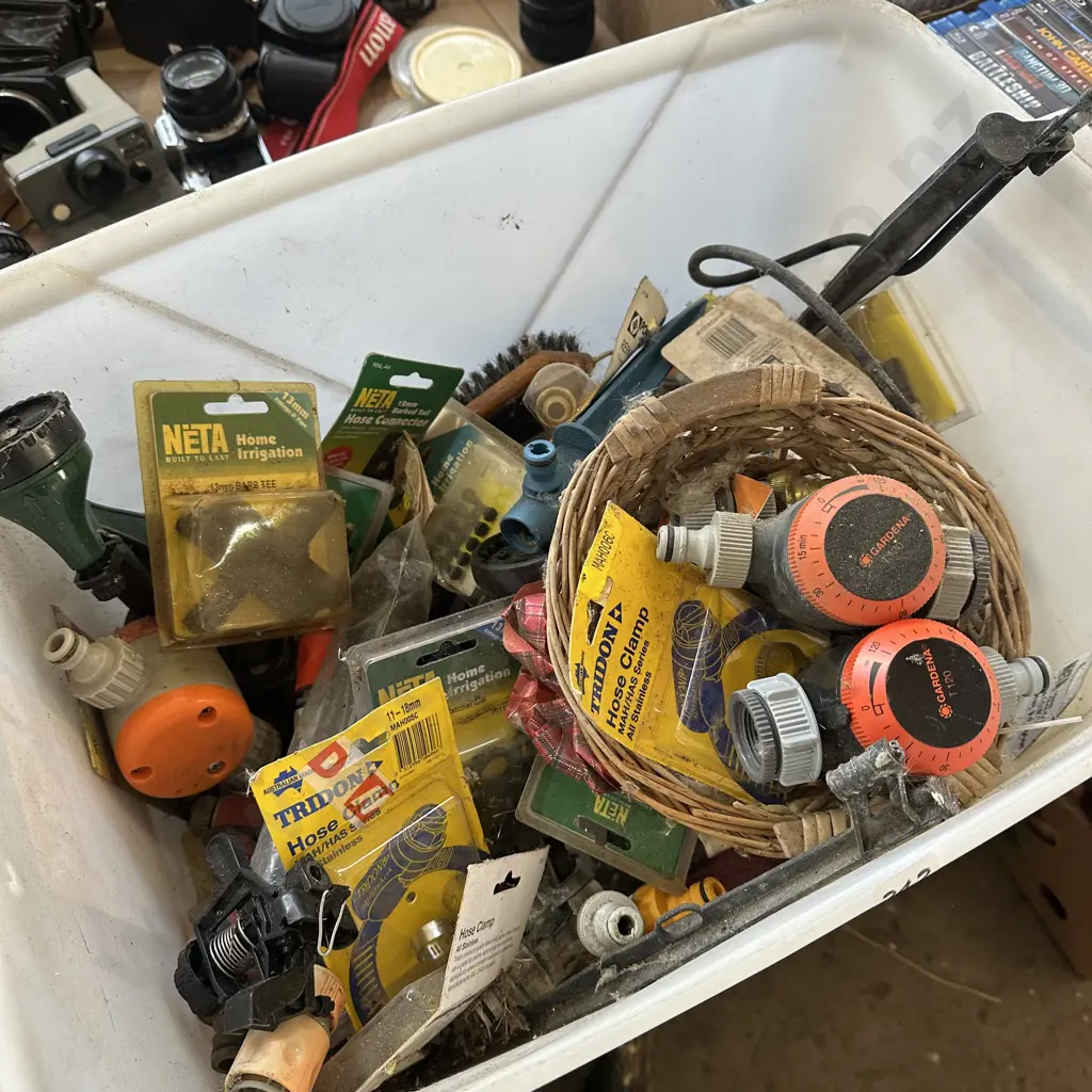 Bin of gardening water timers, hose fittings etc. Image 1++