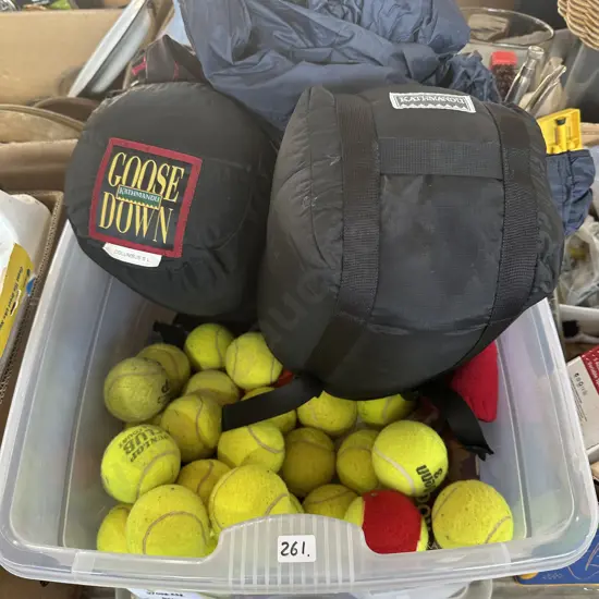 Lidded plastic bin with sleeping bags, coat and tennis balls etc.