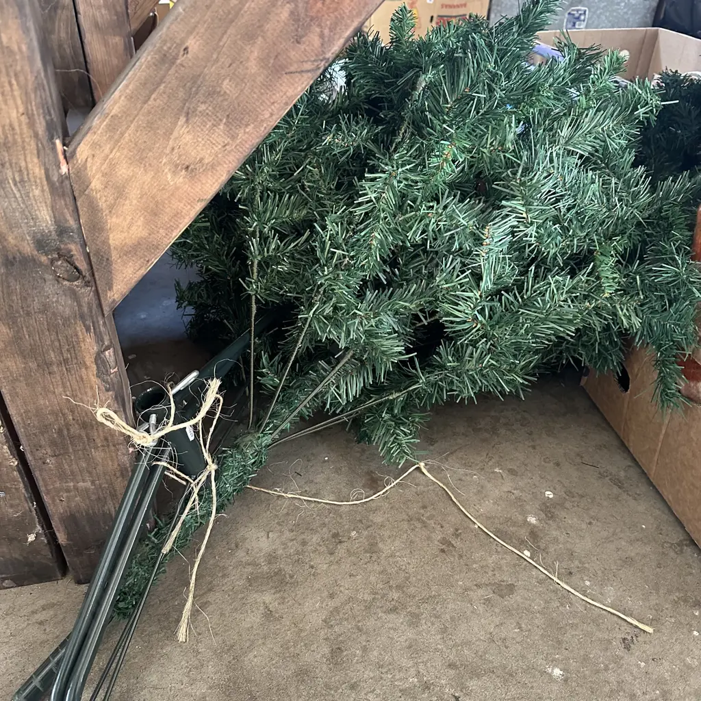 Bin full of christmas decorations, lights, hats and a chrstmas tree etc. Image 1++