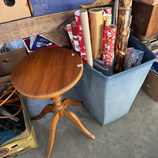 Wine table and bin of wrapping paper.
