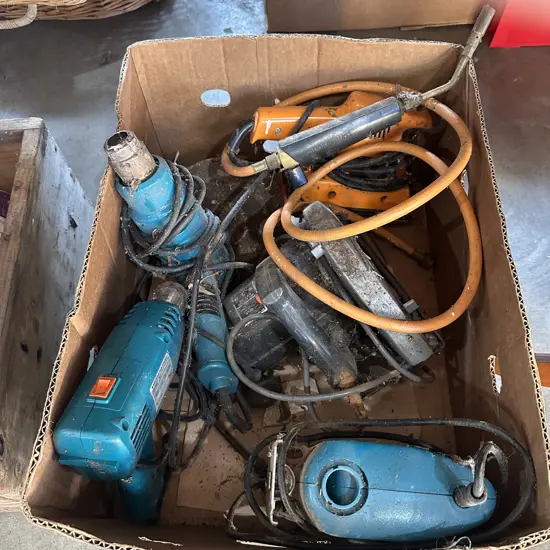 Box lot skill saw, jig saw, sander, two heat guns and gas attachment.