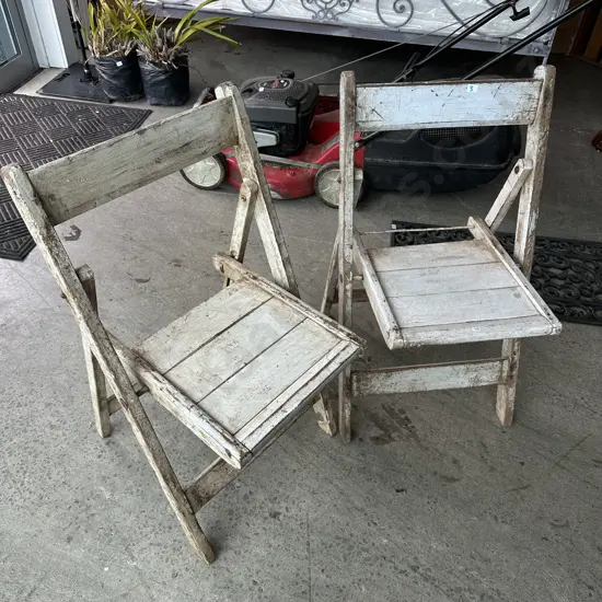 Pr of vintage Indian folding chairs (one has Hindu stenciling)