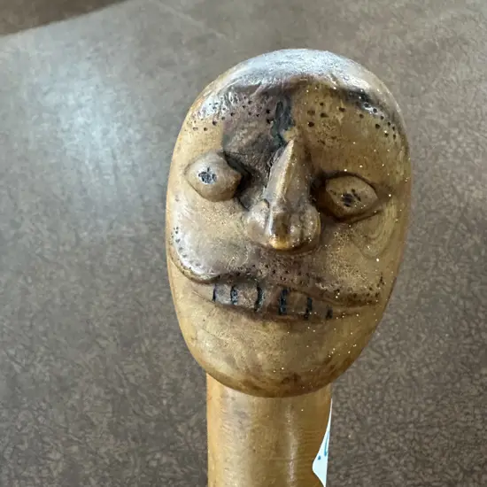 early carved wooden walking stick with snake, lizard, frog etc