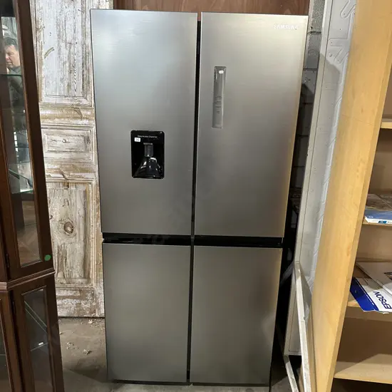 Sumsang double door fridge freezer (virtually unused, still as protection file on shelves)
