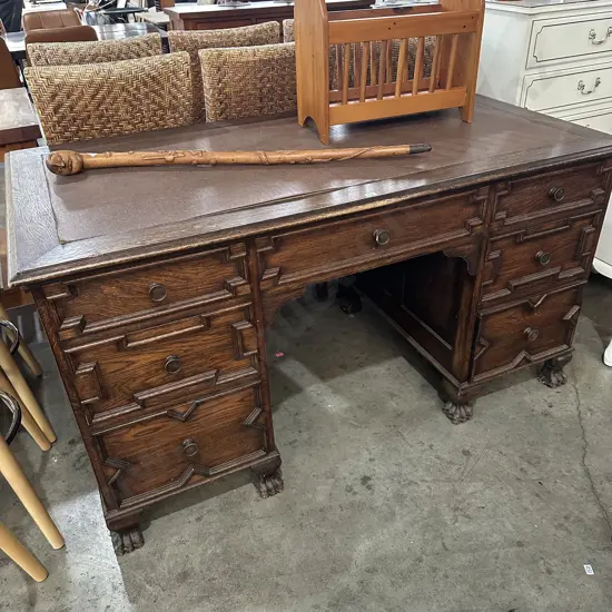 Oak desk with claw and ball feet