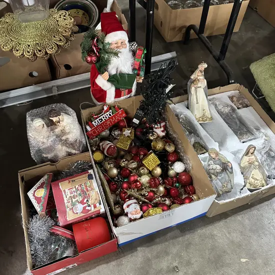 Three boxes of christmas items and decorations.
