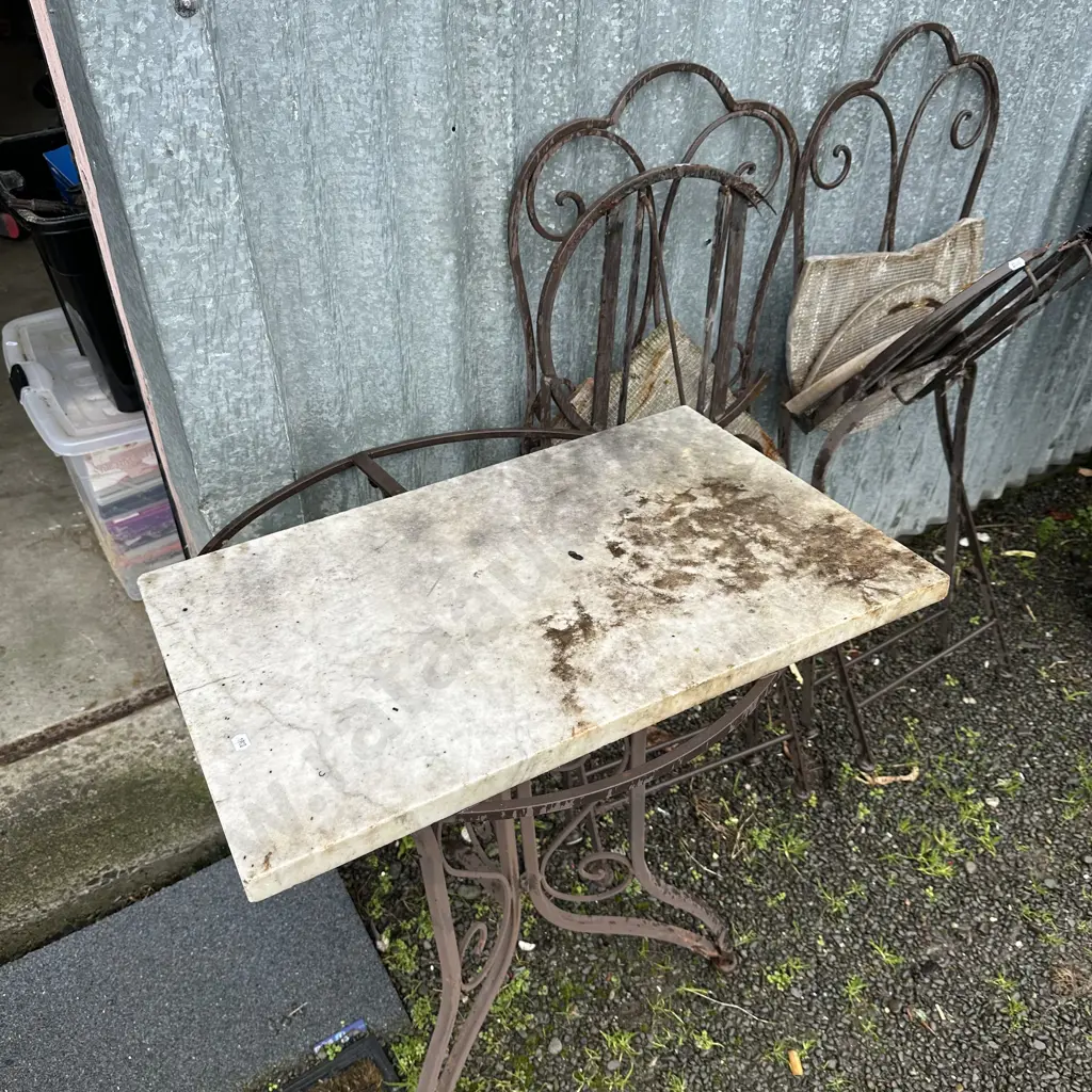 slab of marble and broken/rusty outdoor garden suite Image 1++