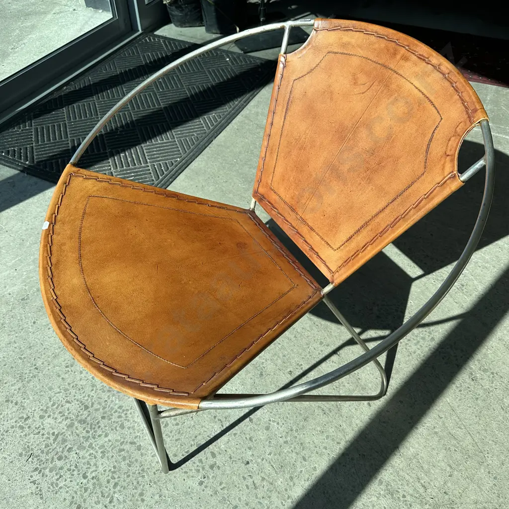 stitched leather accent chair on wrought iron base Image 1++