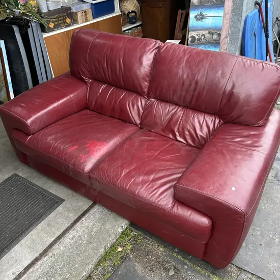 Burgandy leather sofa - has a patch on cushion