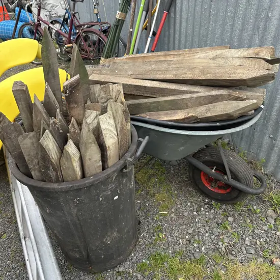 wheel barrow, spare tray and wooden pegs