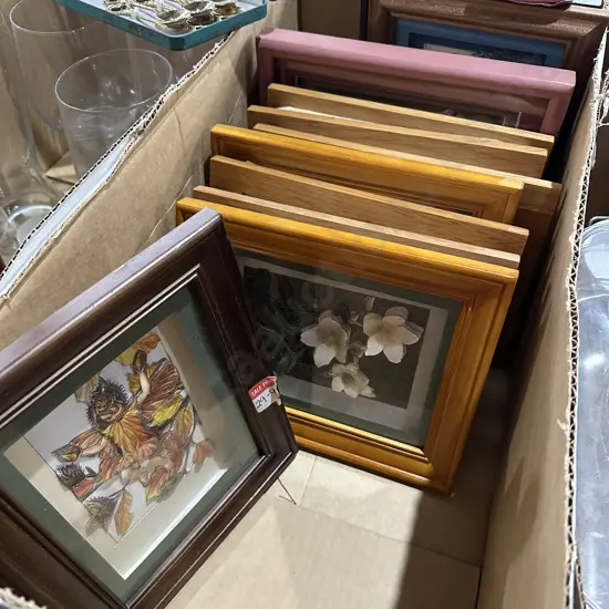 Collection of framed artworks.