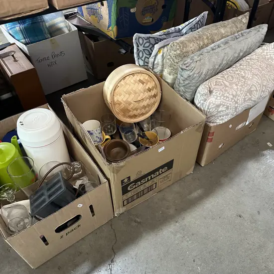 Three boxes cushions and kitchenware.