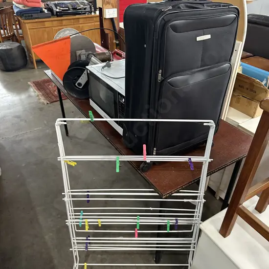 suitcase and clothes horse