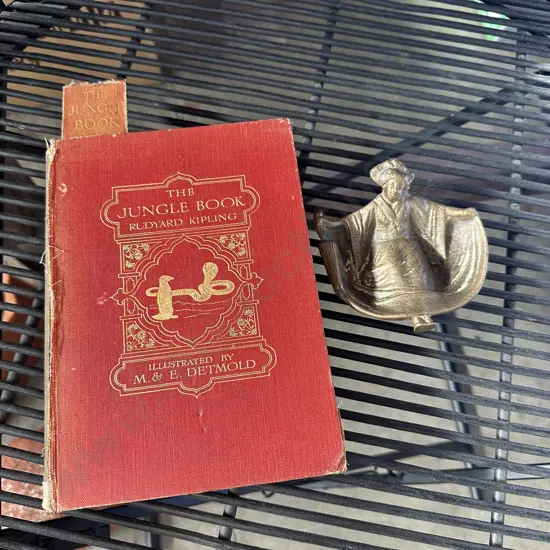 the jungle book and brass figure