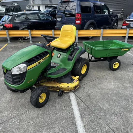 John Deere D140 ride on mower 2015- well maintained plus tipping tow cart