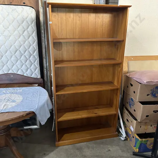 Tidy pine bookcase.