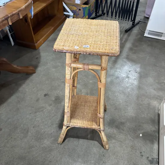 Vintage two-tier bamboo and woven rattan plant stand.