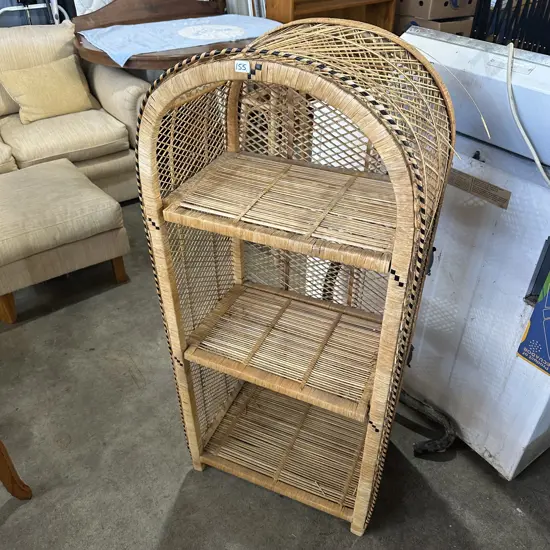 Arched wicker shelving unit.
