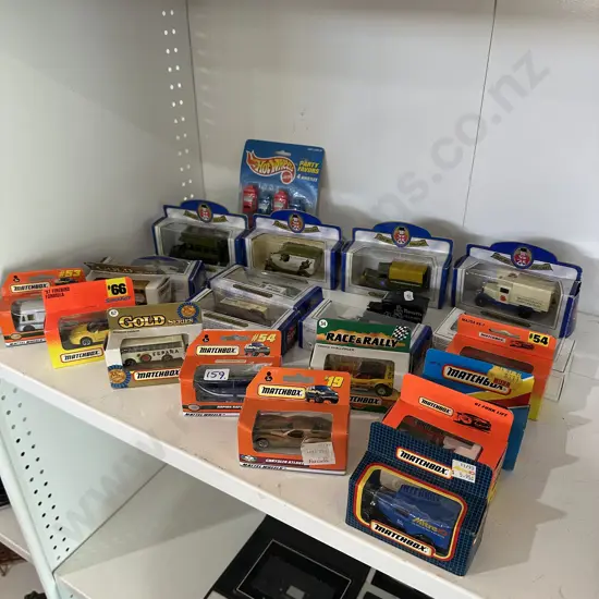 Shelf lot of boxes die-case cars and trucks.