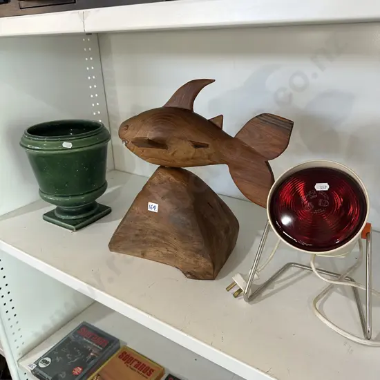 Pedestal planter, heat lamp and hand carved wooden shark sculpture.