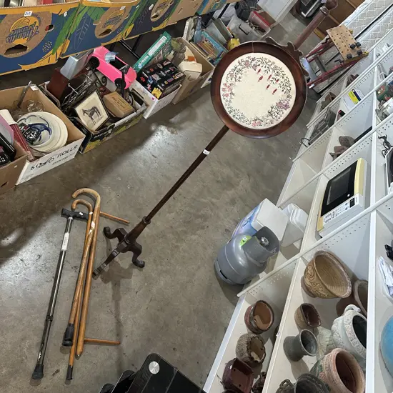 Antique pole screen plus three walking sticks etc.