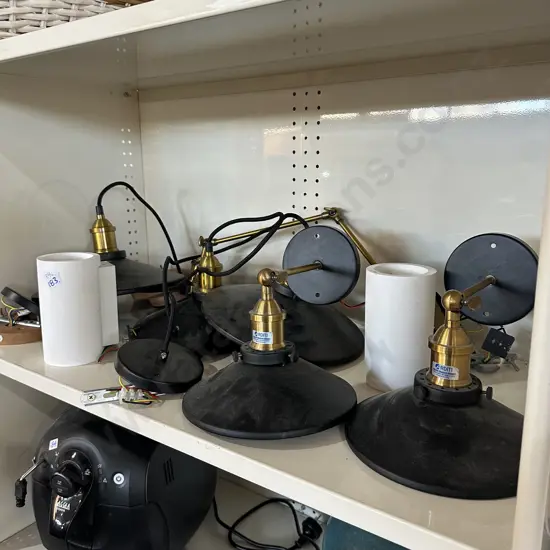 Shelf lot of hanging and wall mount lights.
