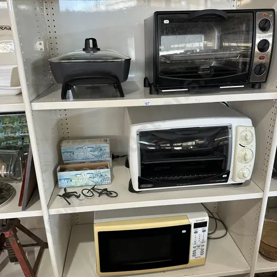 Two bench ovens, petanque balls, metal art and average microwave (missing foot)