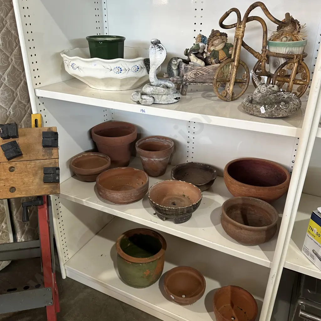 Three shelves of pottery planters and snakes, cane bike etc. Image 1++