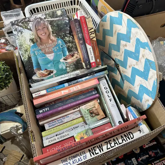 Box of books plus wall clock.